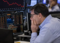 UK equities hover at three-week lows as investors assess global risks